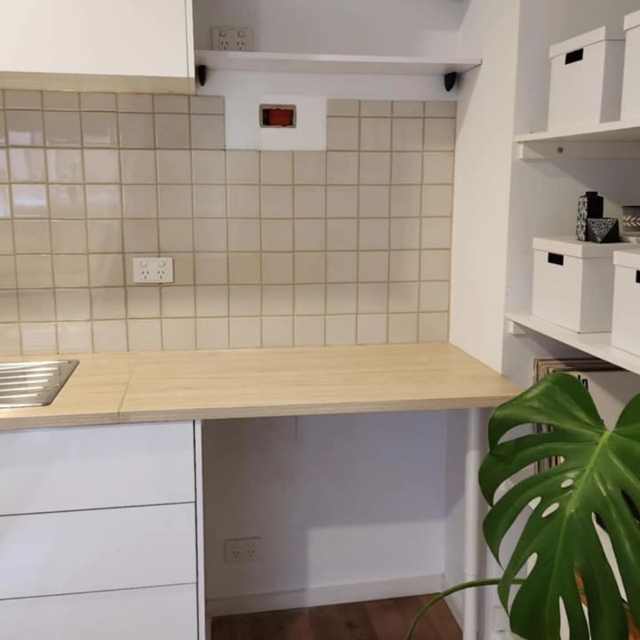 Kitchen fit-out — power and lighting set out around new cabinetry and a timber bench.