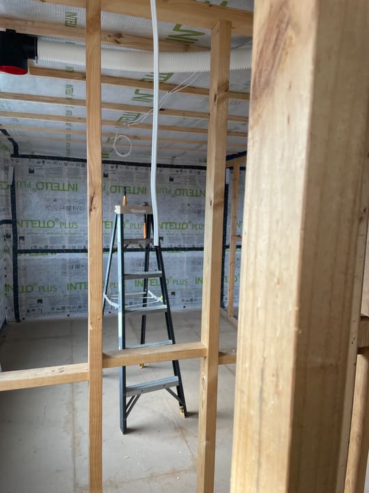 Cabling run through the frame before the wall sheets go on.